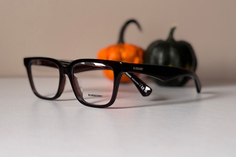 Burberry designer men's eyeglass frame in transparent brown with Burberry gold lettering on the temples BE2425d