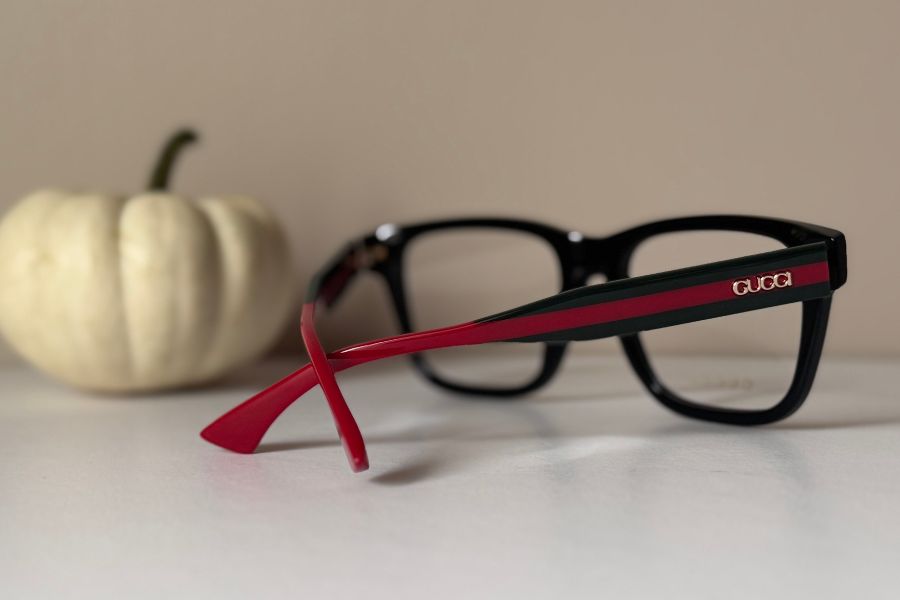 Gucci designer men's eyeglass frame in black with red and green temples GG1870O